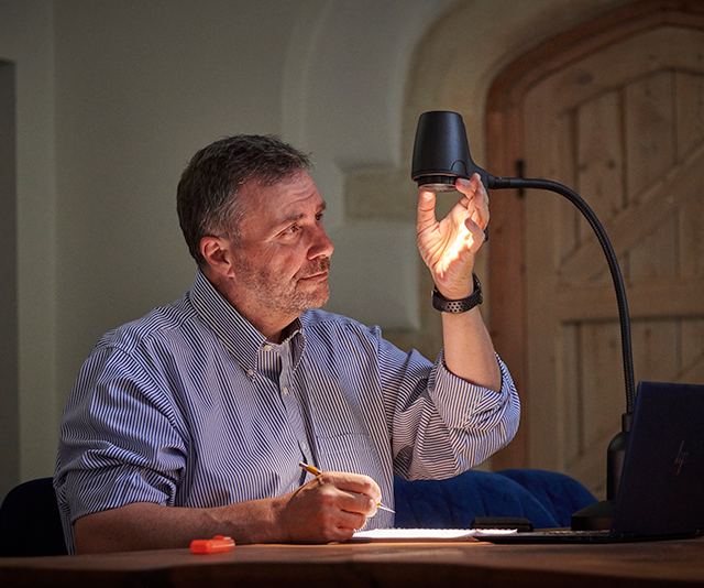 Man reading with HD table light
